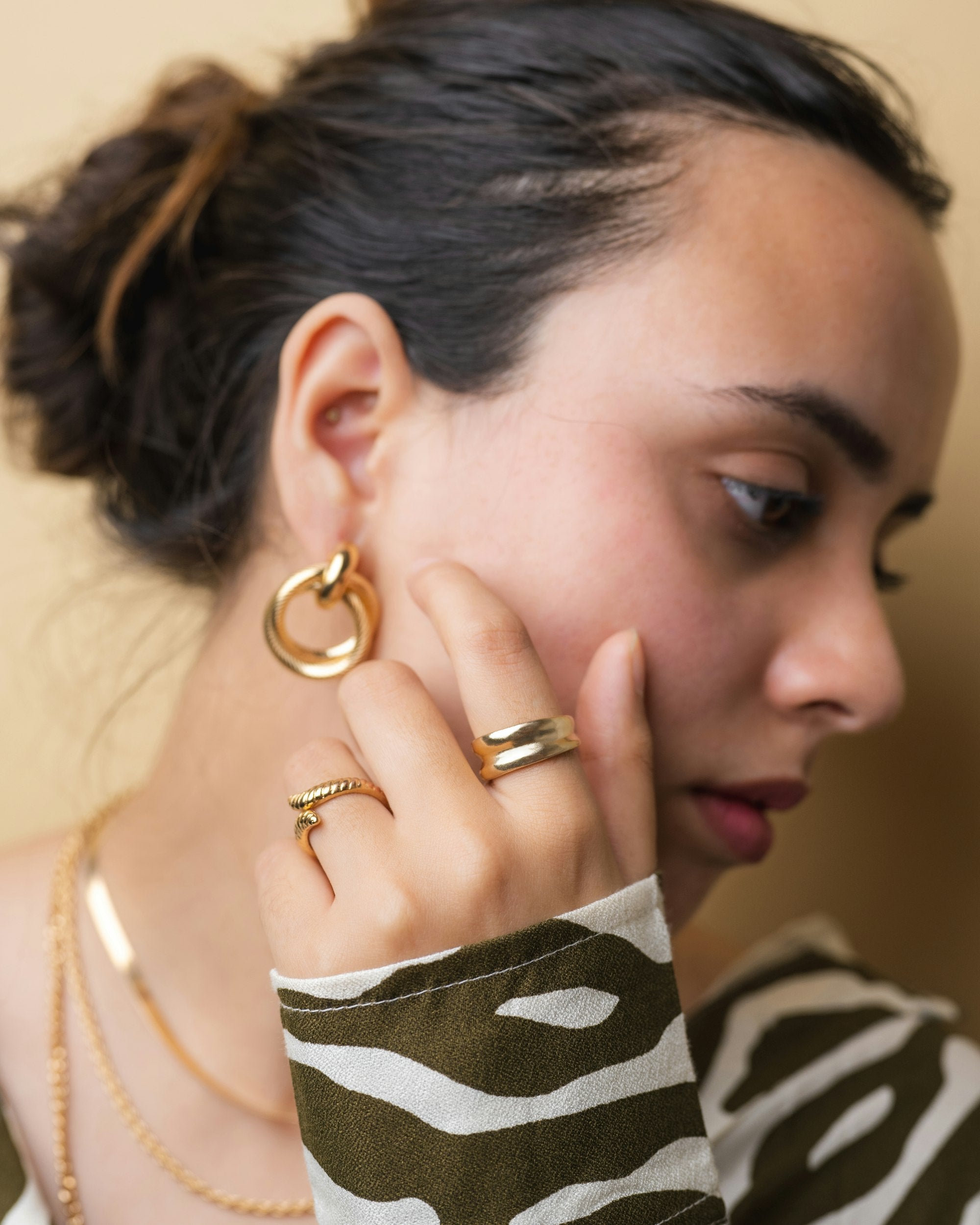 Veliora editorial - model wearing gold rings